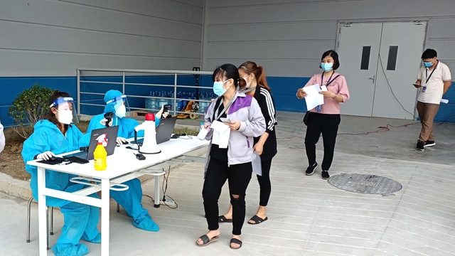 Photo: Vietnamese citizens arrive for Covid-19 vaccines as the government accelerates its vaccination programme. (Source: Vietnam Ministry of Health)